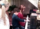 Debby Ryan gives Cameron a quick piano lesson 016