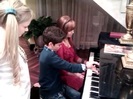 Debby Ryan gives Cameron a quick piano lesson 020