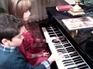 Debby Ryan gives Cameron a quick piano lesson 050