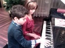 Debby Ryan gives Cameron a quick piano lesson 093