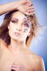 professional-make-up-purple-eye-shadow-and-orange-flowers-artificial-eyelashes