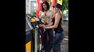 Fill 'er up! The Divas joke around at the gas pumps.