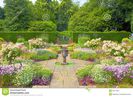 formal-english-garden-landscaped-flagged-summer-flowers-stone-vase-32717693