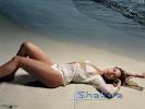 shakira-white-bikini-lying-on-beach