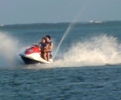 miley-cyrus-nick-jonas-jet-skiing[1]