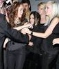 miley-cyrus_COM-hollywood2008oct15-edhardlyfashionshow0007